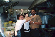 Photo of Huey Michelle and Raj in the kitchen at Gloucester Motel.