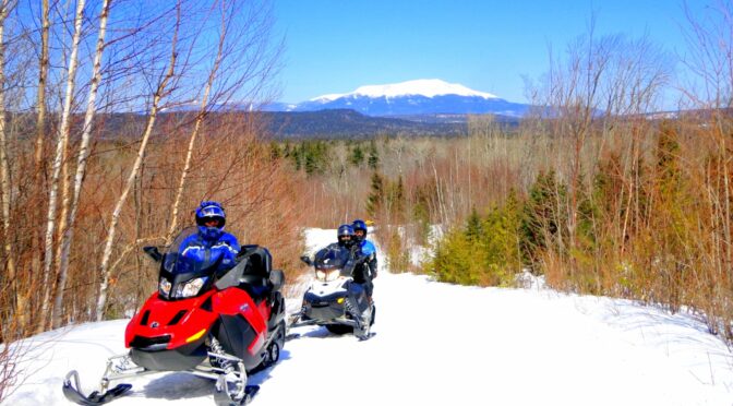 Ray, Sarah, Deb sledding in Maine.